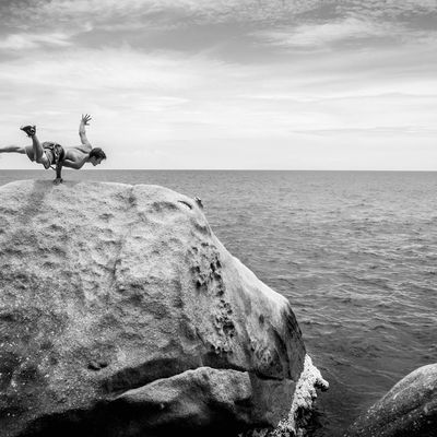 Silhouette of a man in a balancing pose.
